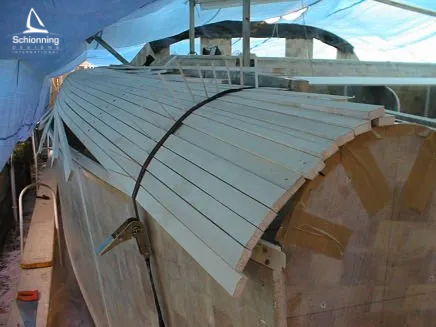 Catamaran Kit Building Process by Schionning Designs SDI -Step 11 The next step is our hull-to-deck joins, side decks and close the shell. As you can see strip planking methods are used here to ensure a pleasing design to the eye. This technique is not difficult and the planks are once again glassed in place to ensure again stiffness and strength.