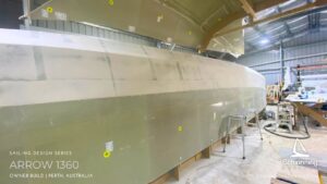 Schionning Designs - Arrow 1360 - 1st 6Months Build Progress - Arrow 1360 Catamaran owner build review located in Perth, Western Australia Demonstrates Schionning Designs detailed multihull kit construction system Shows how experienced owner-builders achieve precise alignment and excellent structural consistency Professional-level results using composite kit construction Six month build progress with hull panels fitted, glassed, and ready for fairing Cabin top constructed first and hoisted into shed roof due to space constraints Main crossing bulkheads joined and reinforcements completed Bulkheads stacked in installation order for efficient workflow MDF build jigs supplied with kit, quick to assemble and accurate Hull jig built in two days with frames aligned to DuFlex panels Forebeam and daggerboards constructed alongside main build Goal to complete bridge deck and hulls by May Bulkhead and bridge deck installation planned for June Exciting and rewarding owner build journey